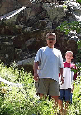 Looking up at Chris and Andrew coming down a trail at Packer Lake.  May 2004